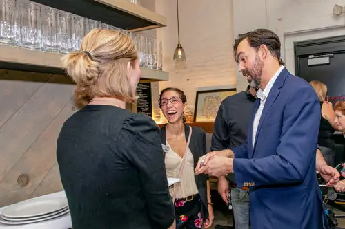 Adam Stone showing something to his fans and having fun with their