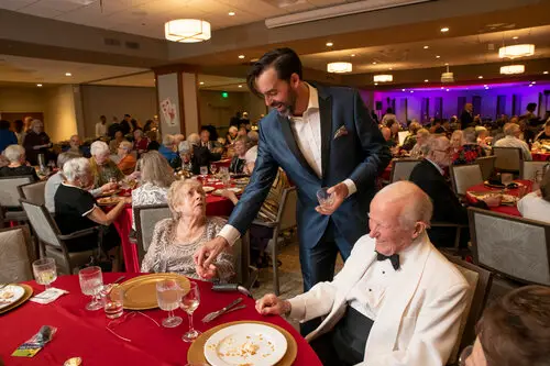 Adam Stone performs close-up magic at dinner tables to entertain adults