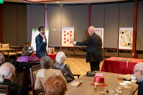 Adam Stone card Magic show with adult people